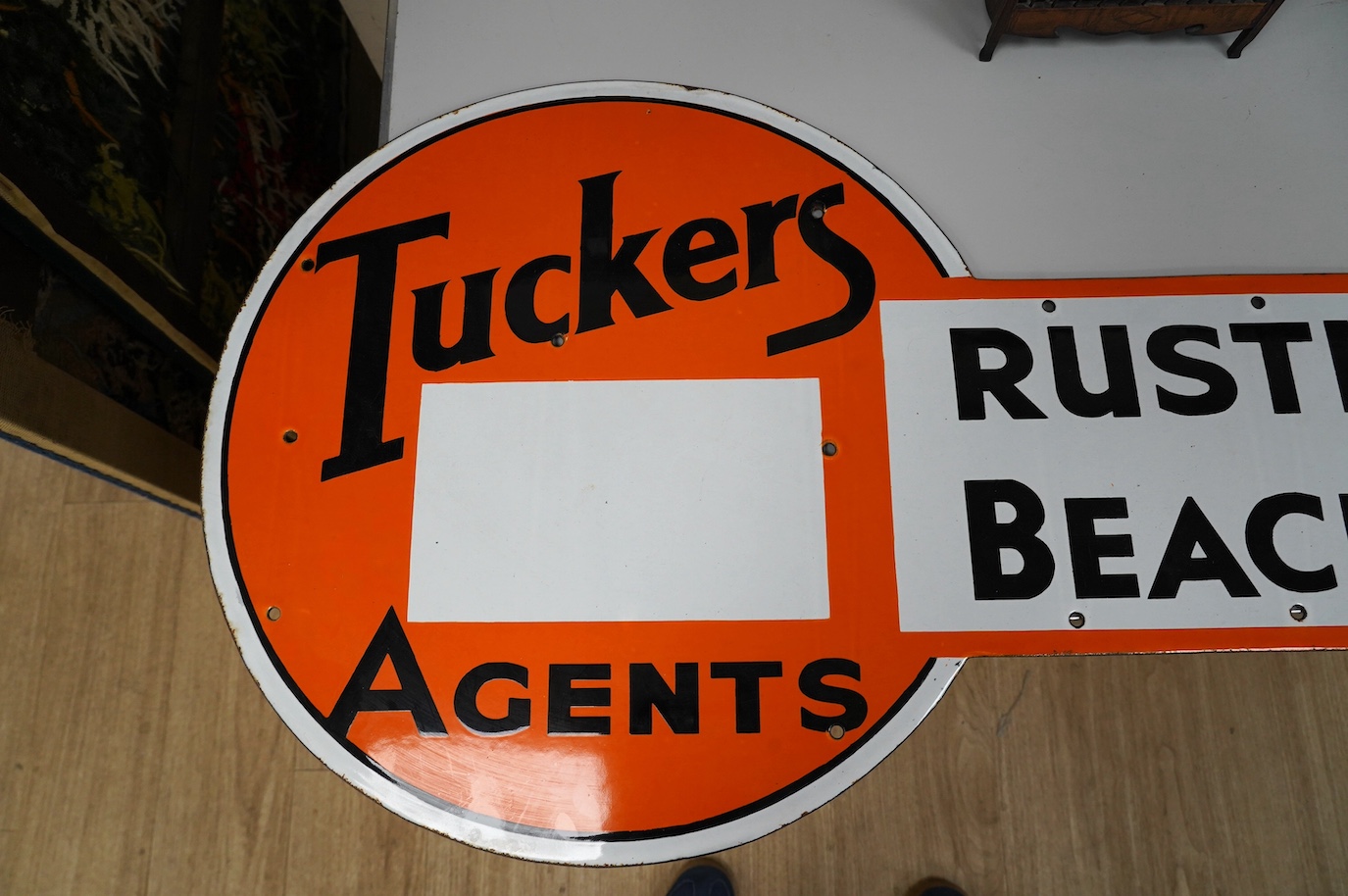 A 1930s Tuckers Agents Rustington Beach Estate enamel sign, 118cm. Condition - fair, wear to edges